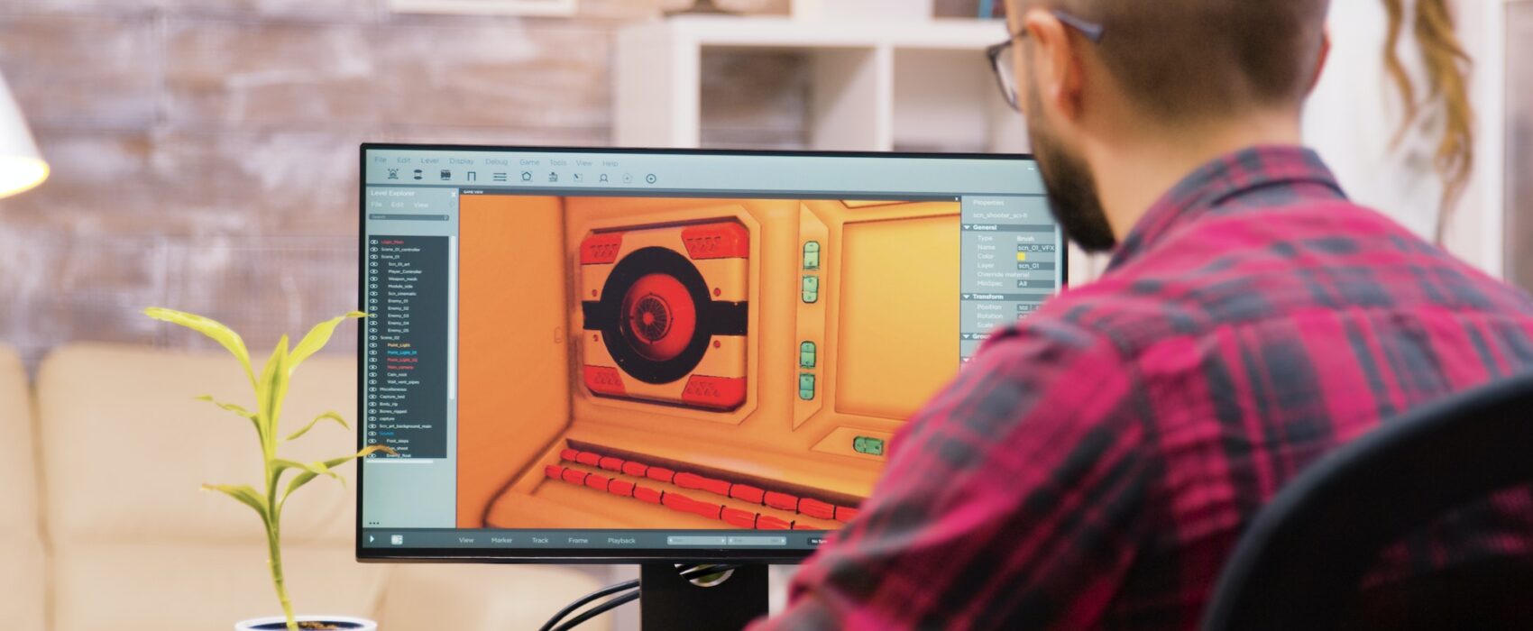 Close up shot of game developer working on a new level of game