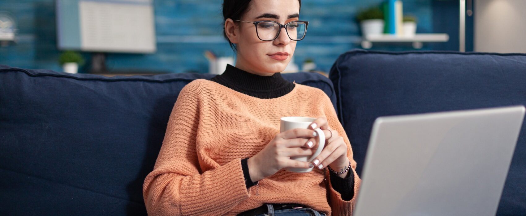 Student reading marketing courses drinking cup of coffee