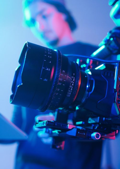 Camera crew with professional camera in studio