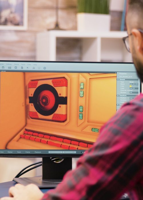 Close up shot of game developer working on a new level of game